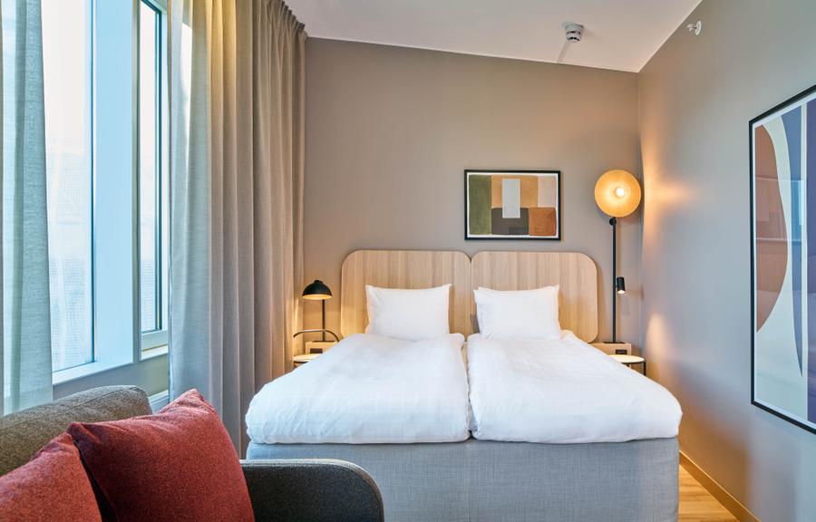 bed in standard room at scandic wallin in stockholm