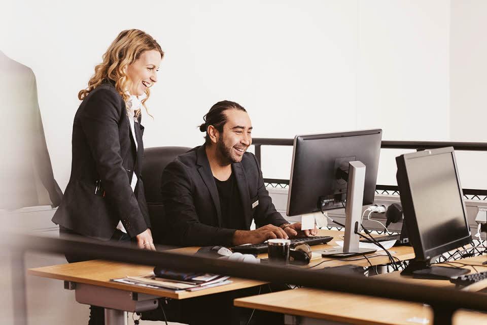 two people looking at computor