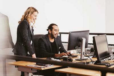 two people looking at computor
