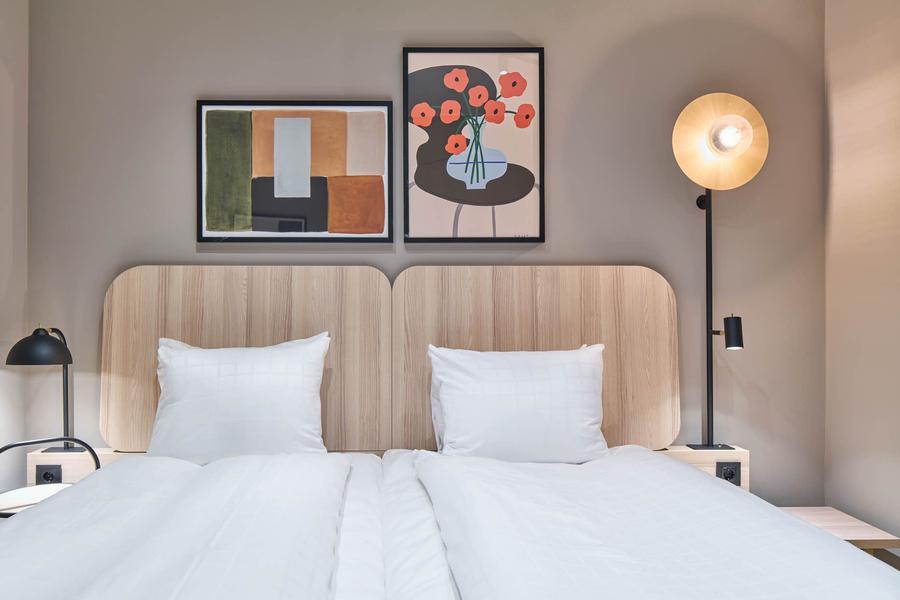 bed in standard room without window at scandic wallin in stockholm