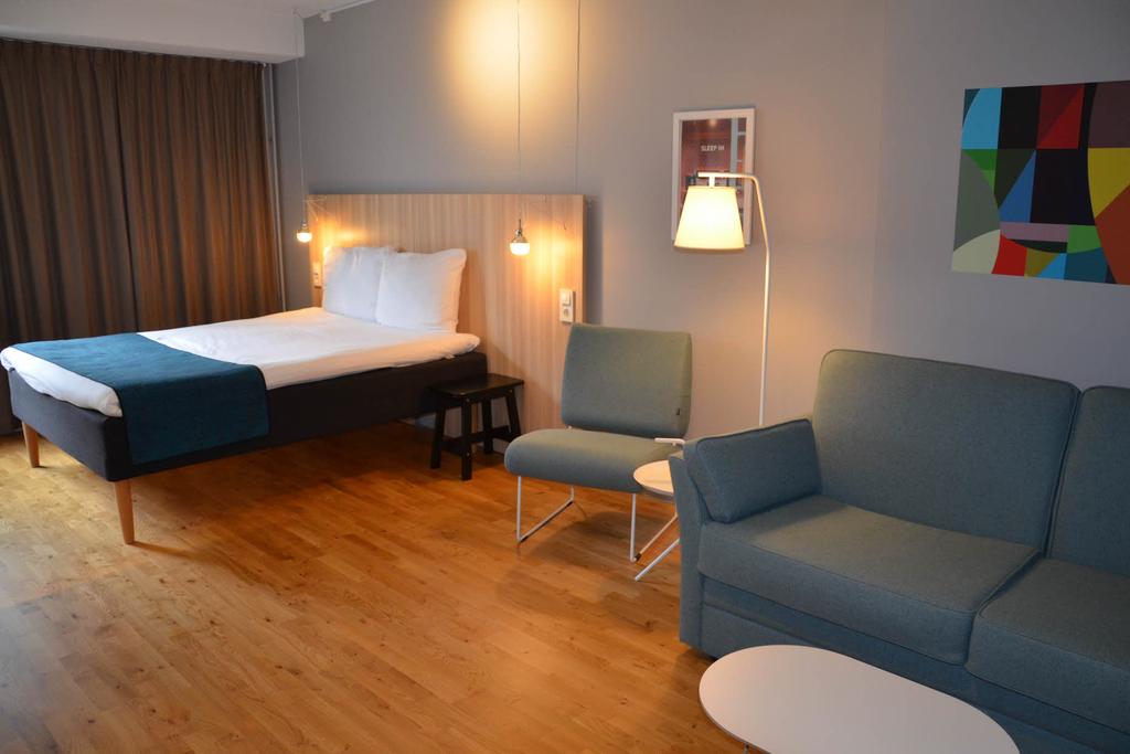 family room with sofa bed at scandic kista in stockholm sweden