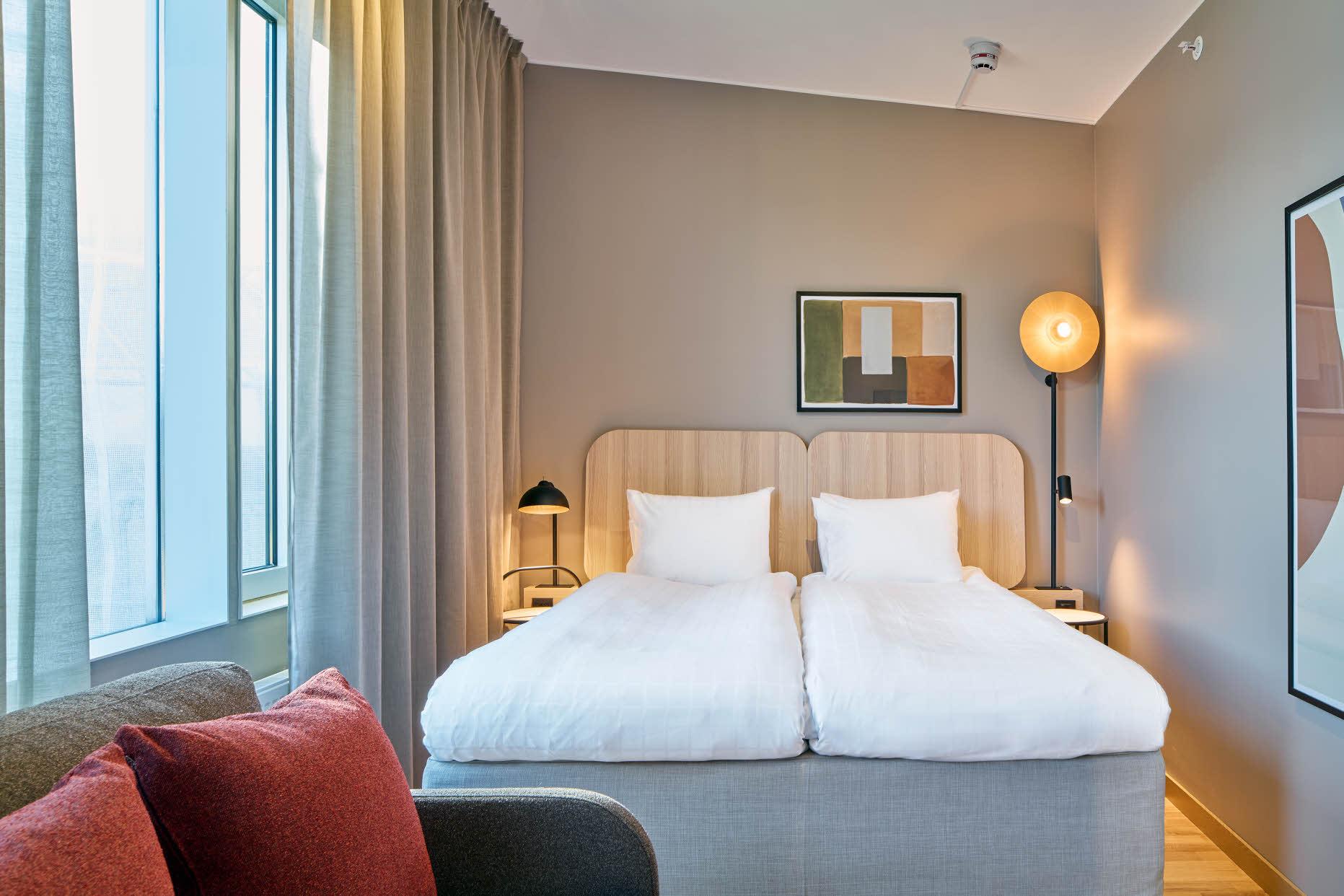 bed in standard room at scandic wallin in stockholm