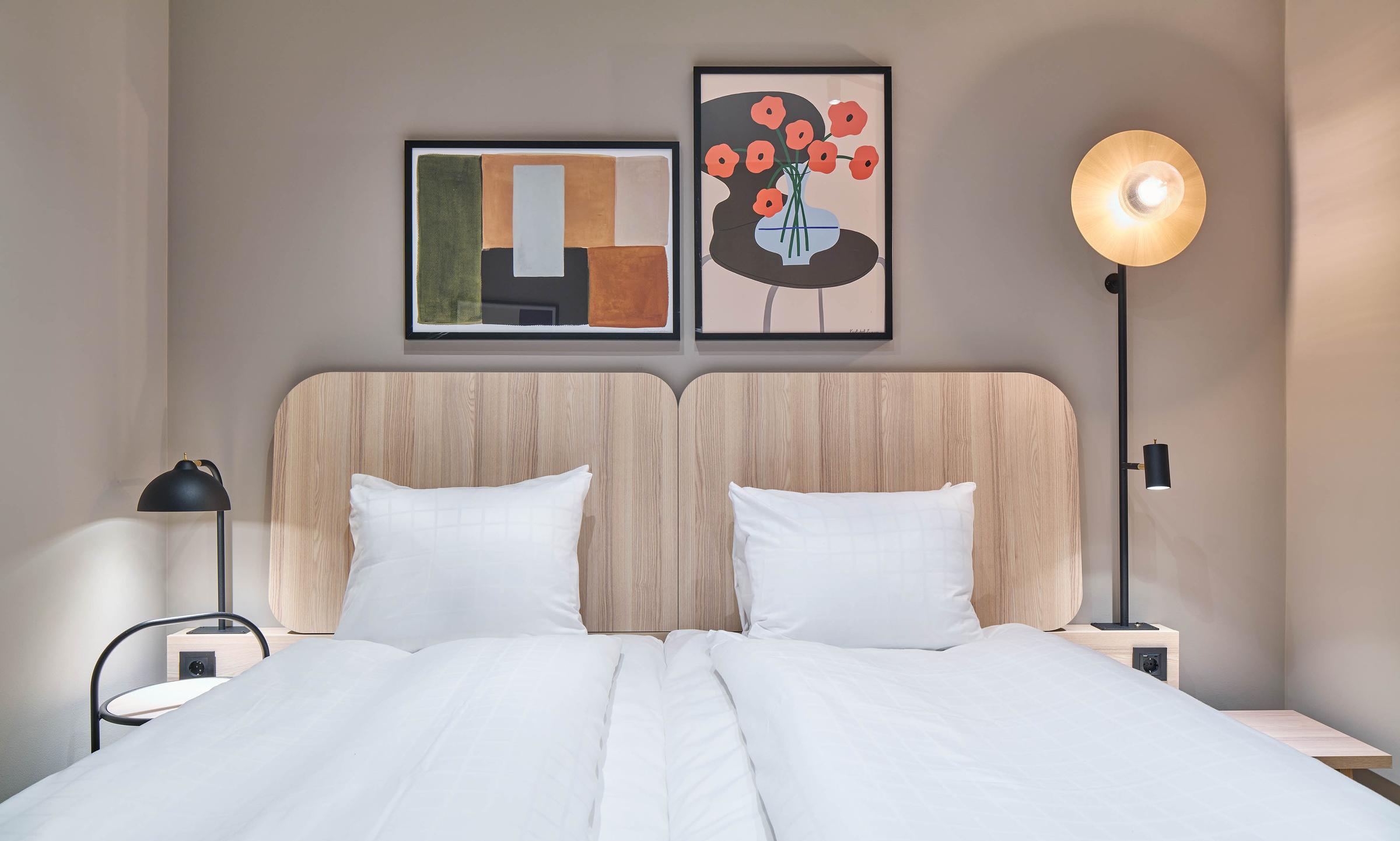 bed in standard room without window at scandic wallin in stockholm