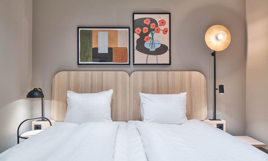 bed in standard room without window at scandic wallin in stockholm