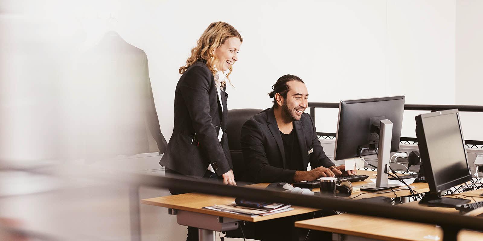 two people looking at computor