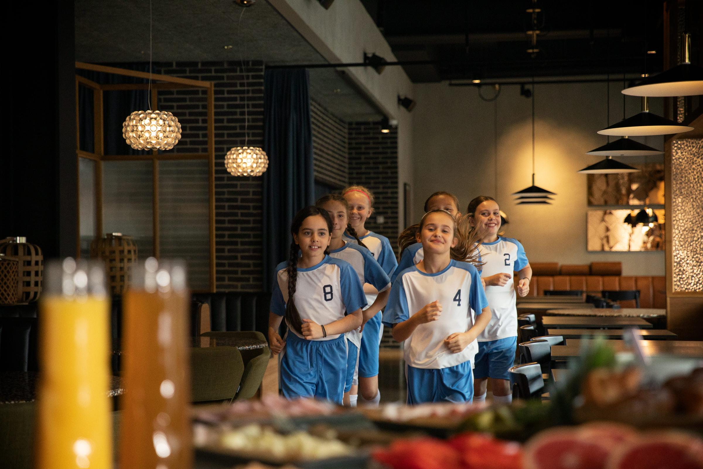 Three sport kids running for breakfast