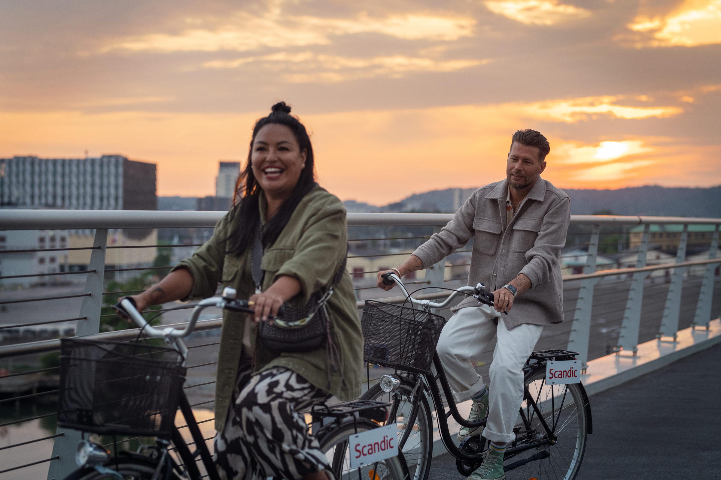 A couple biking in the city