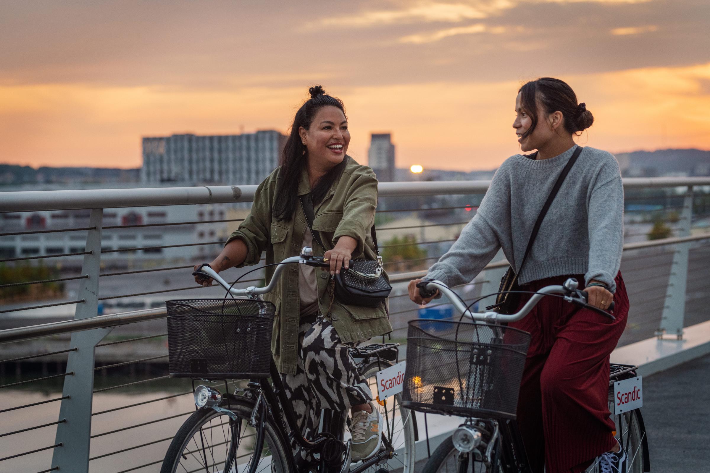 Friends riding bikes in the city