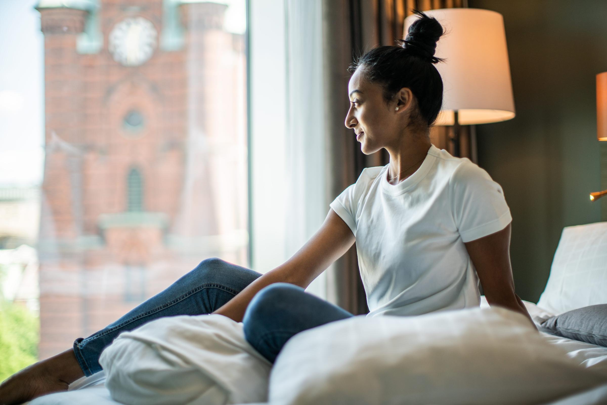 Woman looking out a window