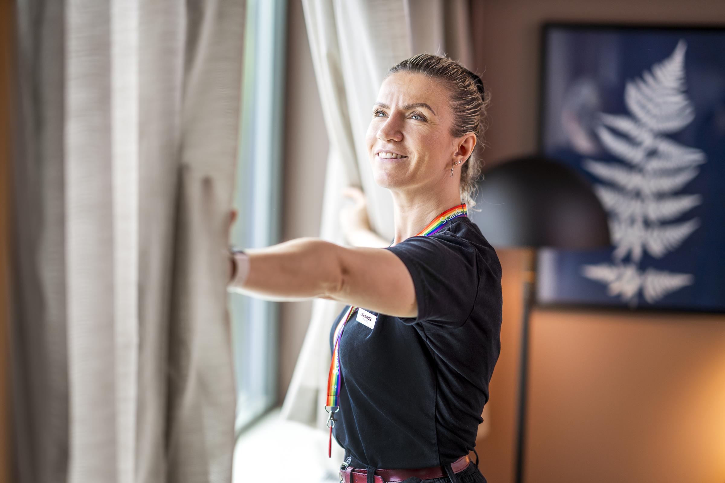 Team member cleaning a room