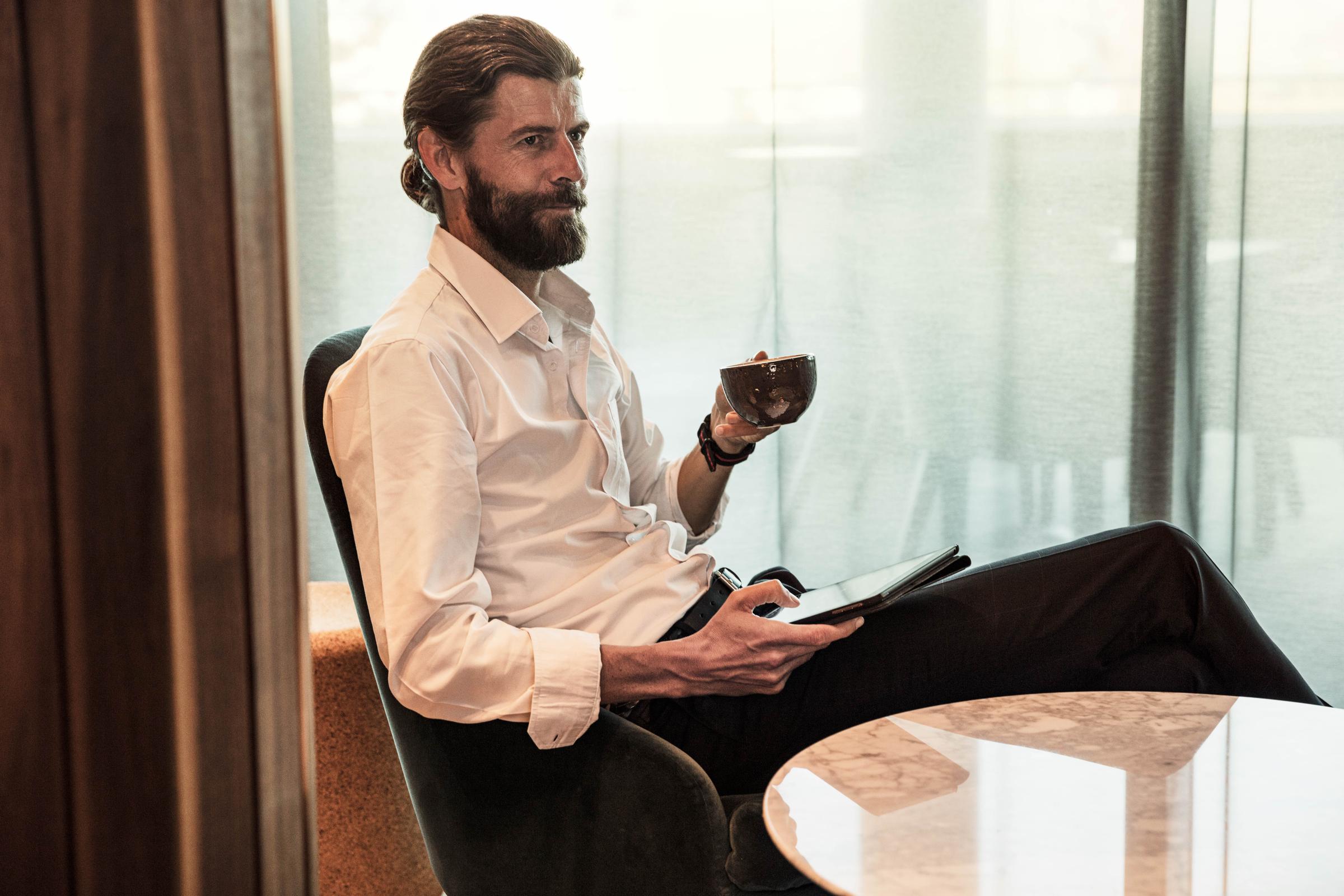 Man enjoying a coffee in the lobby