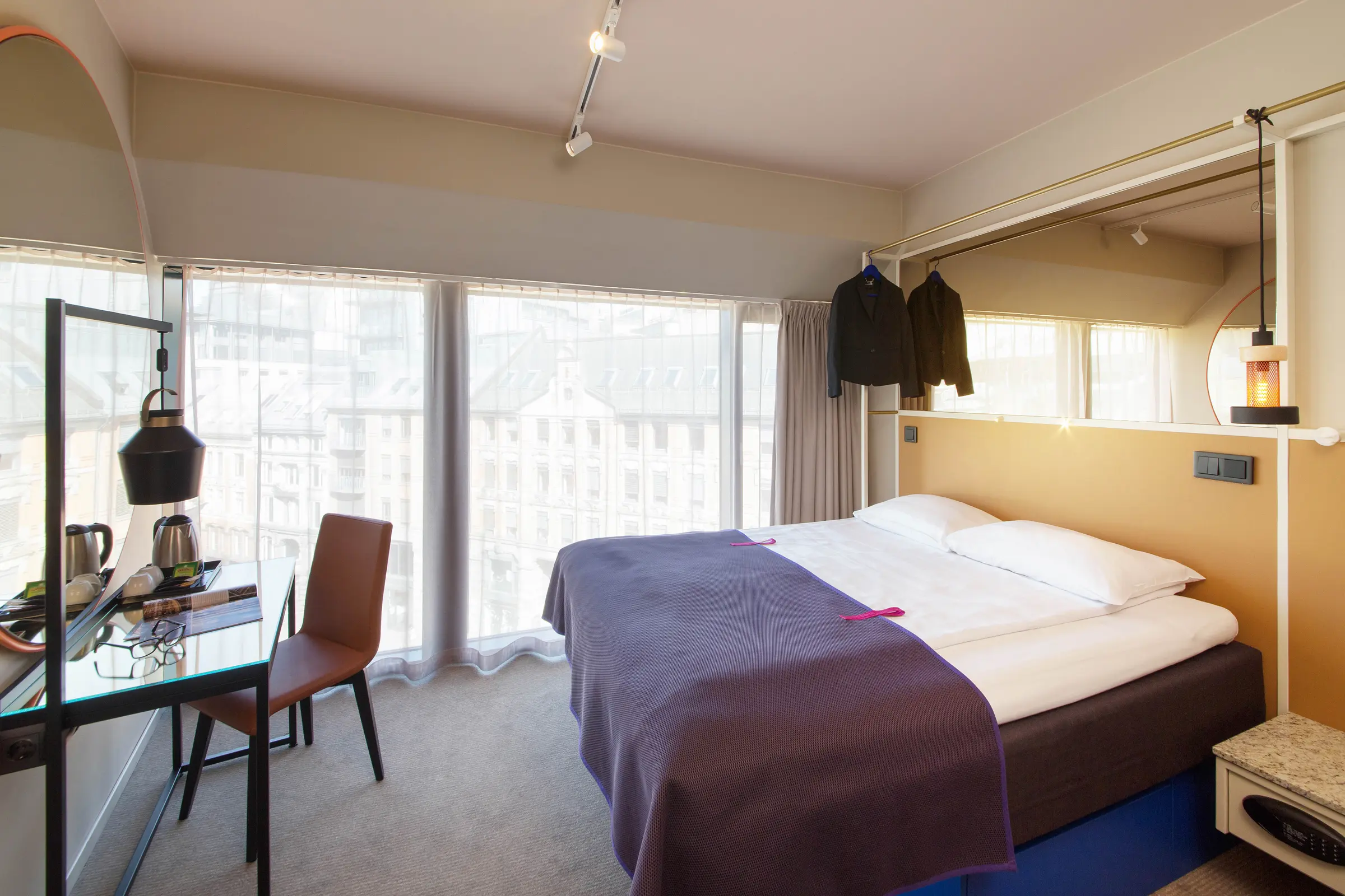 Bed and desk in room Superior