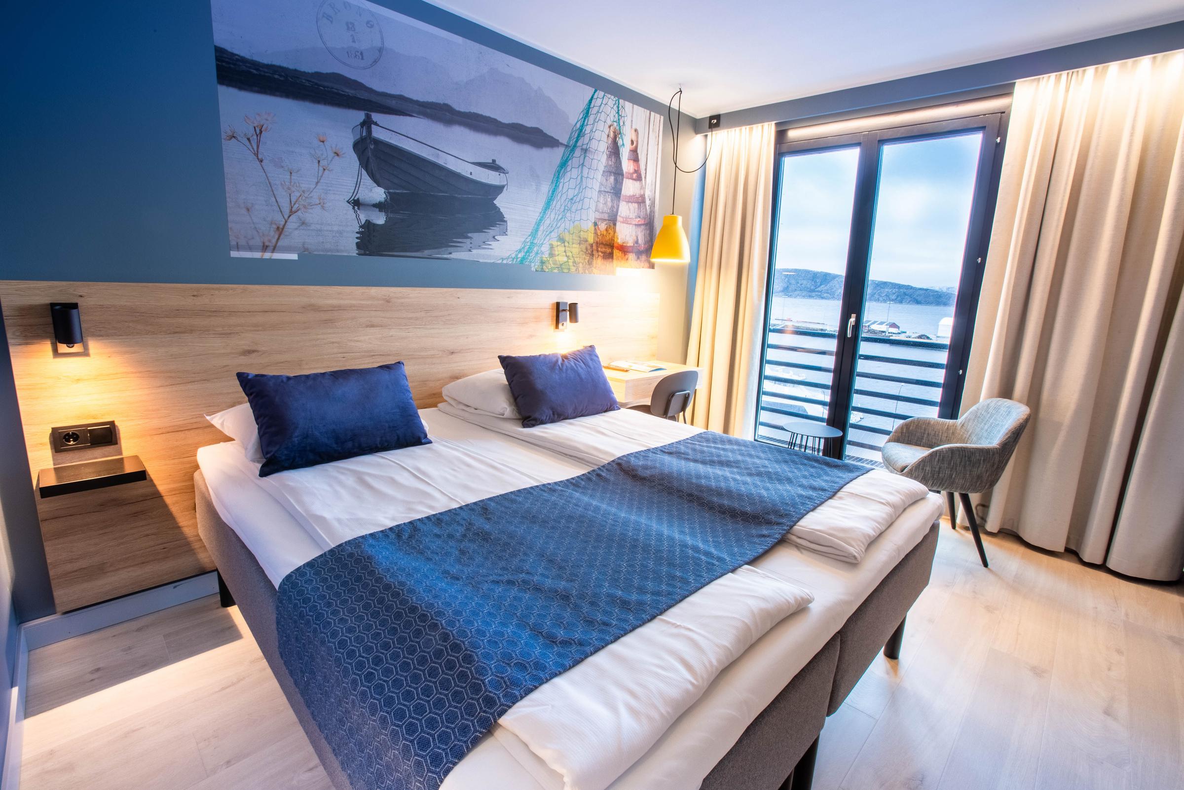 Room with queen bed and window