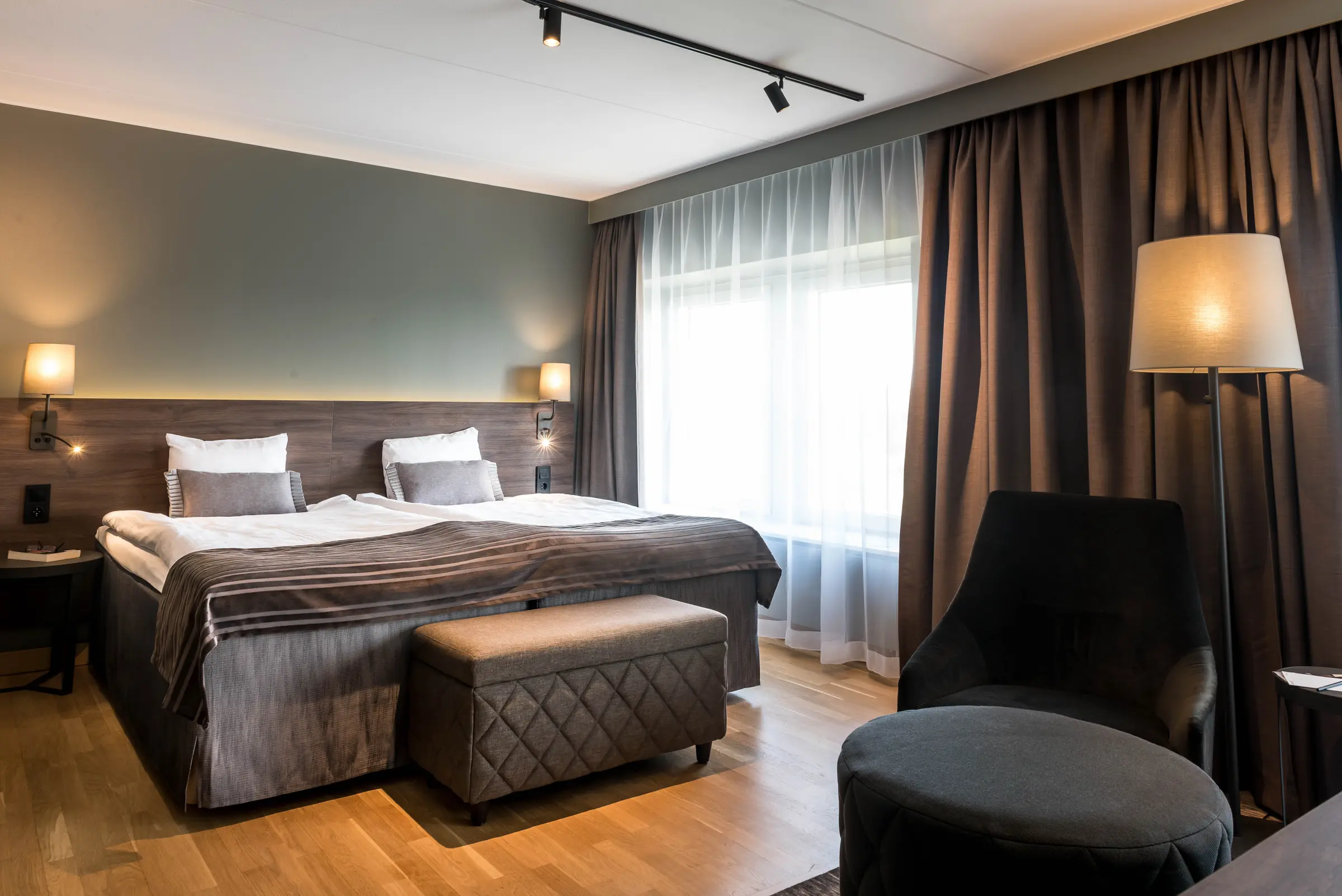 Bed in Master Suite at Scandic Infra City