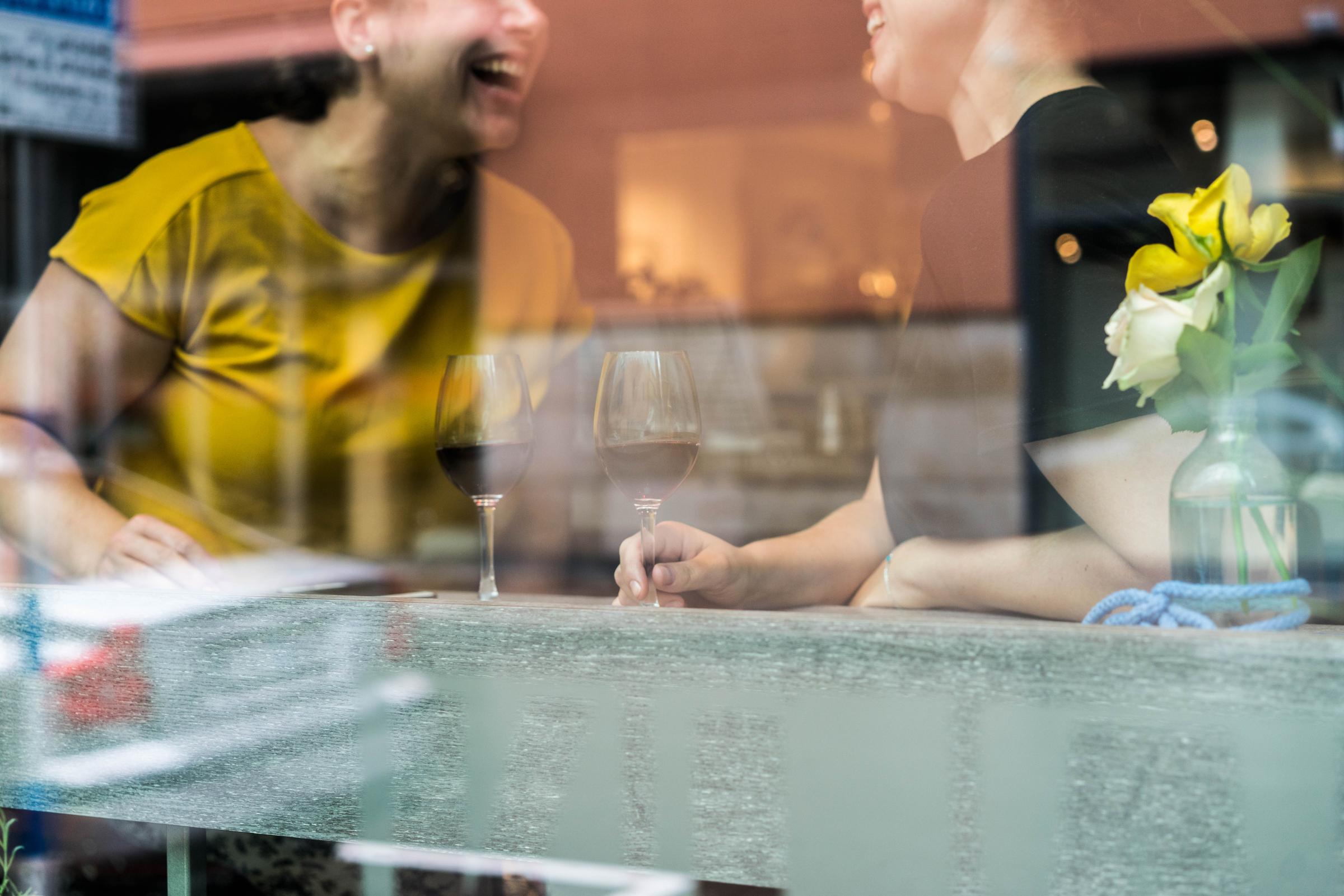 Two female friends having a drink