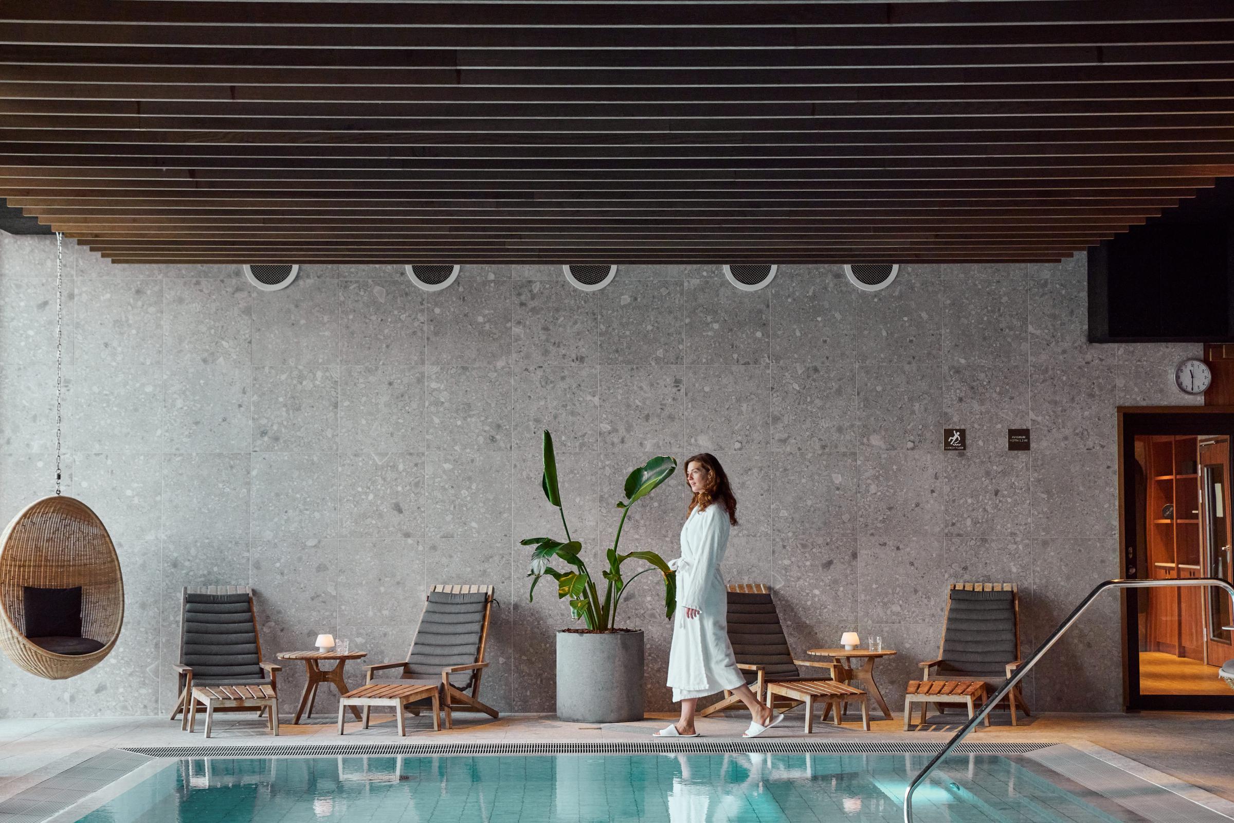 Woman beside the wellness pool