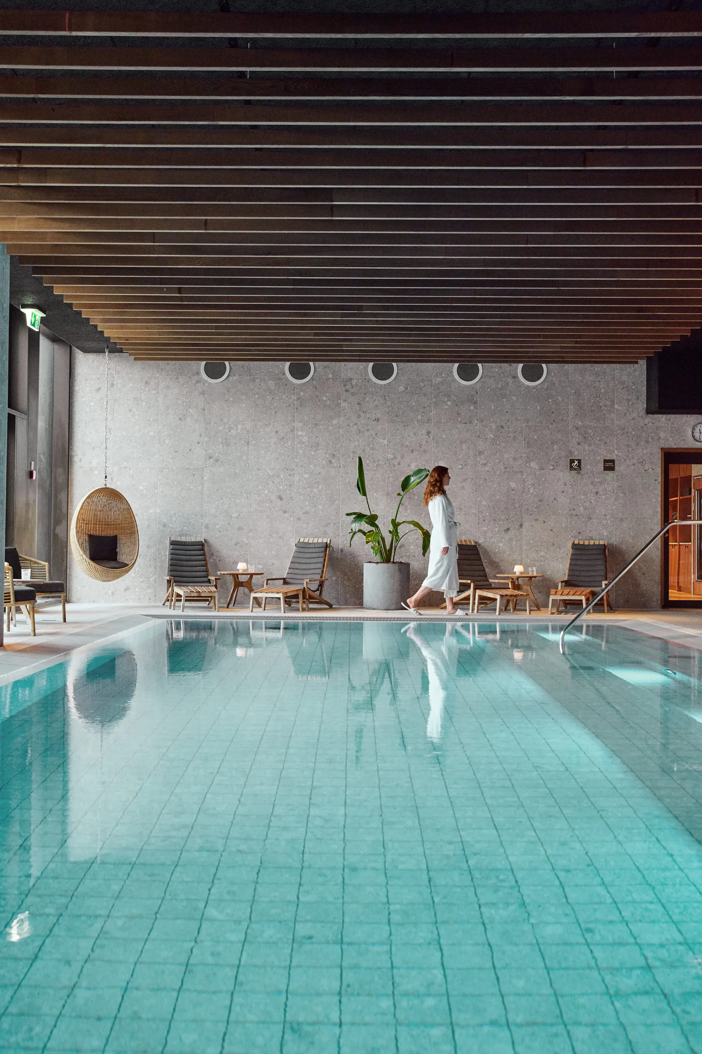 Woman beside the wellness pool