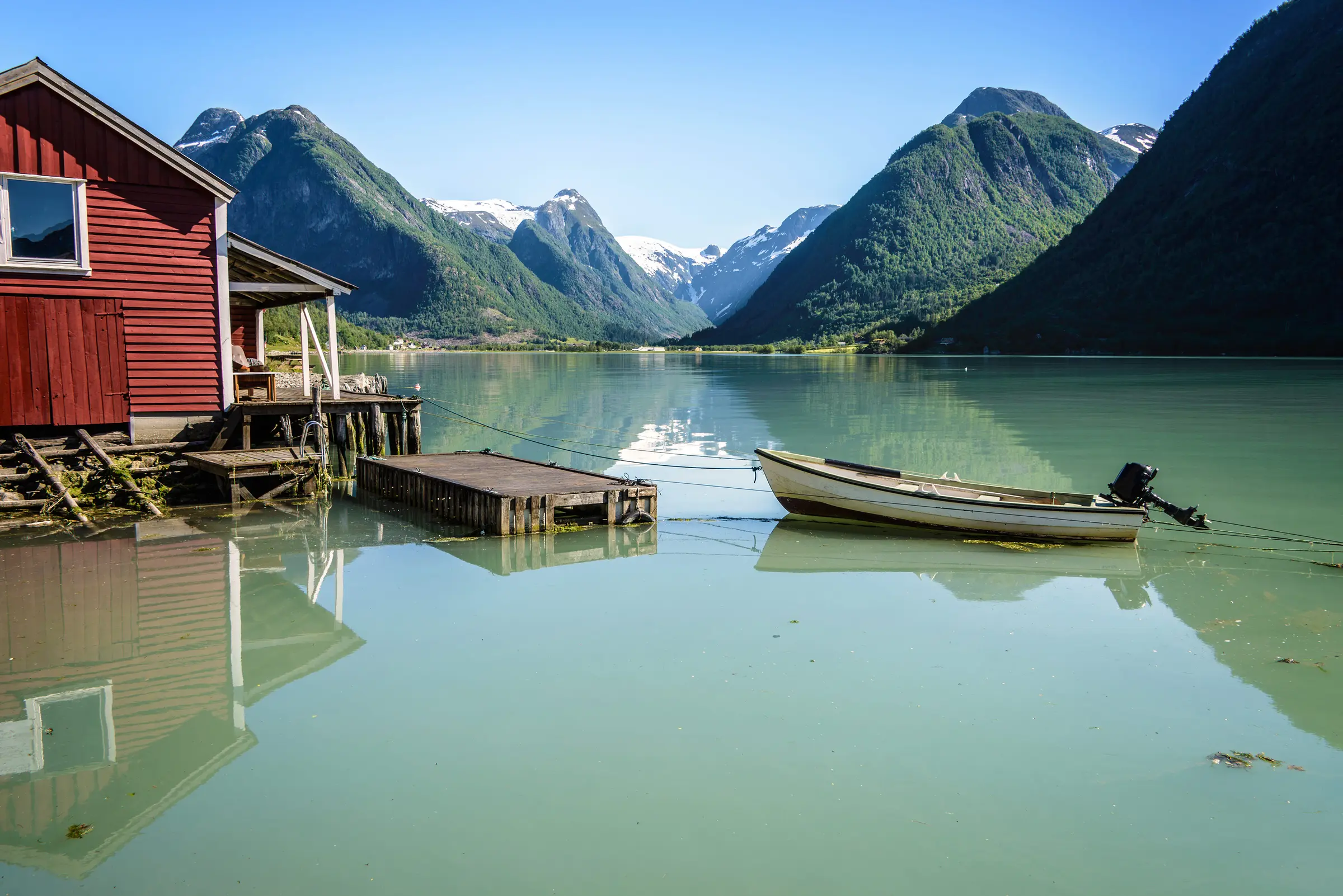 500px Photo ID: 94520553 - Reflection of a boat, a jetty, a red boathouse and mountains in the tranquil water of Fjærlandsfjord, part of the Sognefjord in the village of Fjærland or Mundal, Sogn og Fjordane, Fjord Norway.