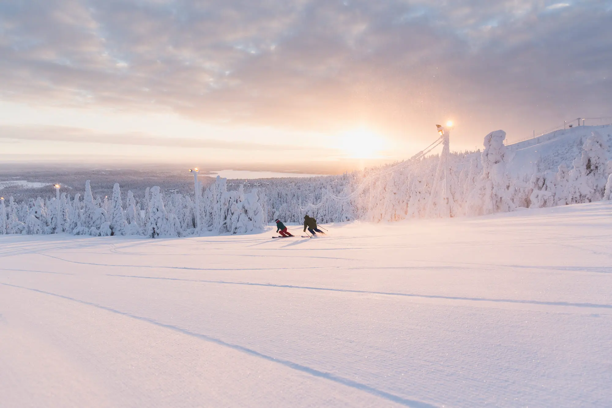 Ruka Ski Resort, skiers in sunset