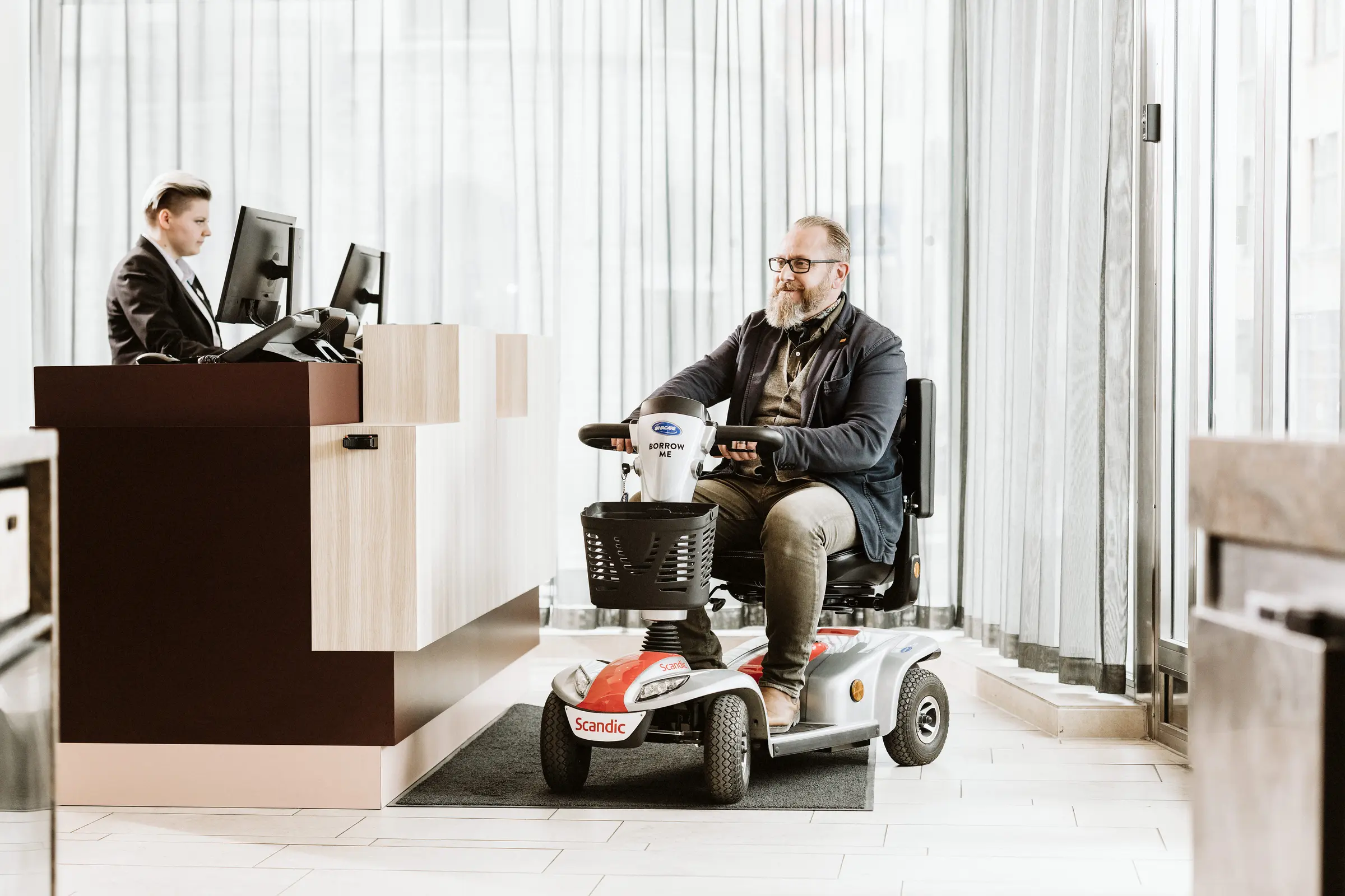 a_man_drives_a_scooter_at _the_reception
