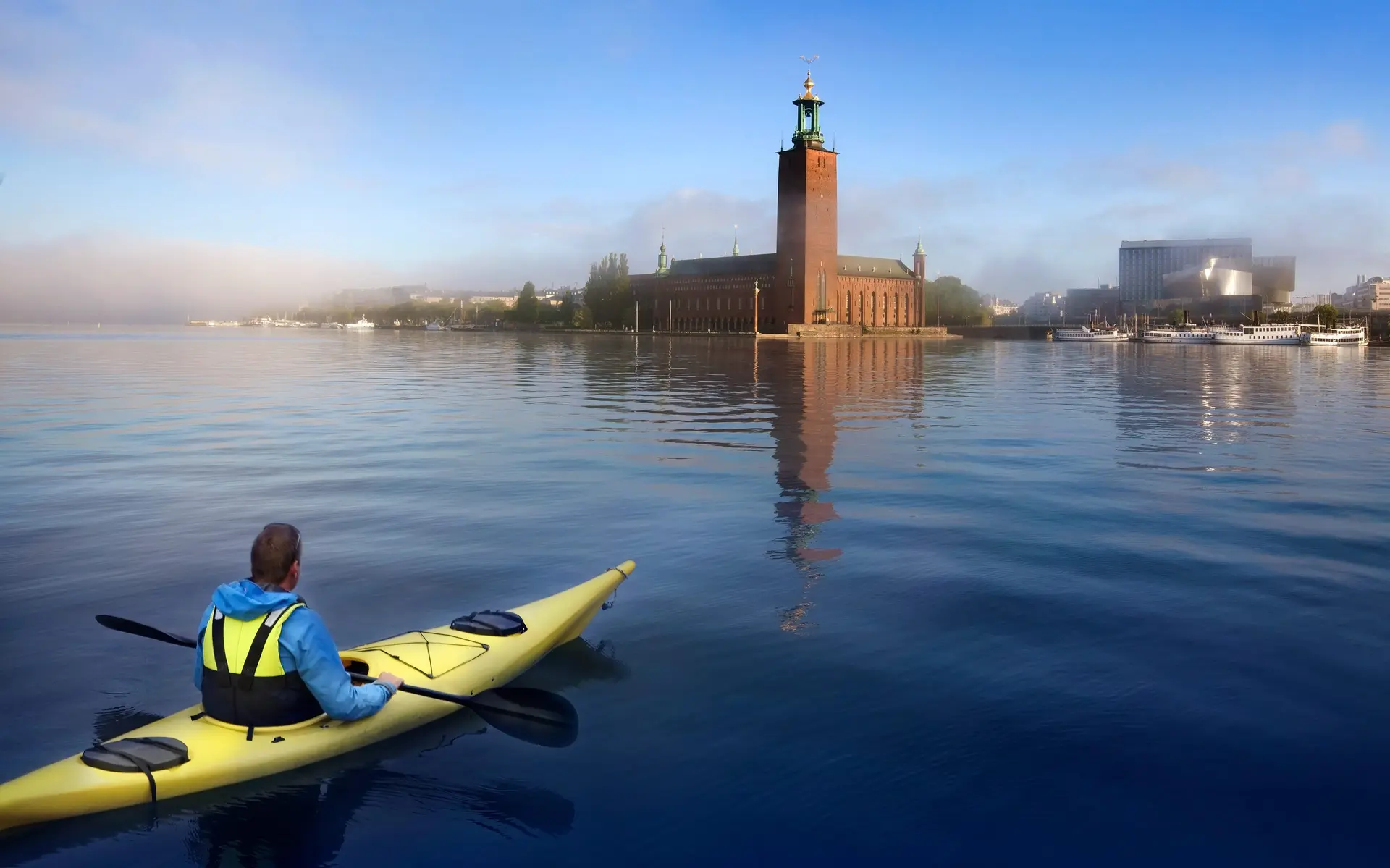 Man paddling in Stockholm city