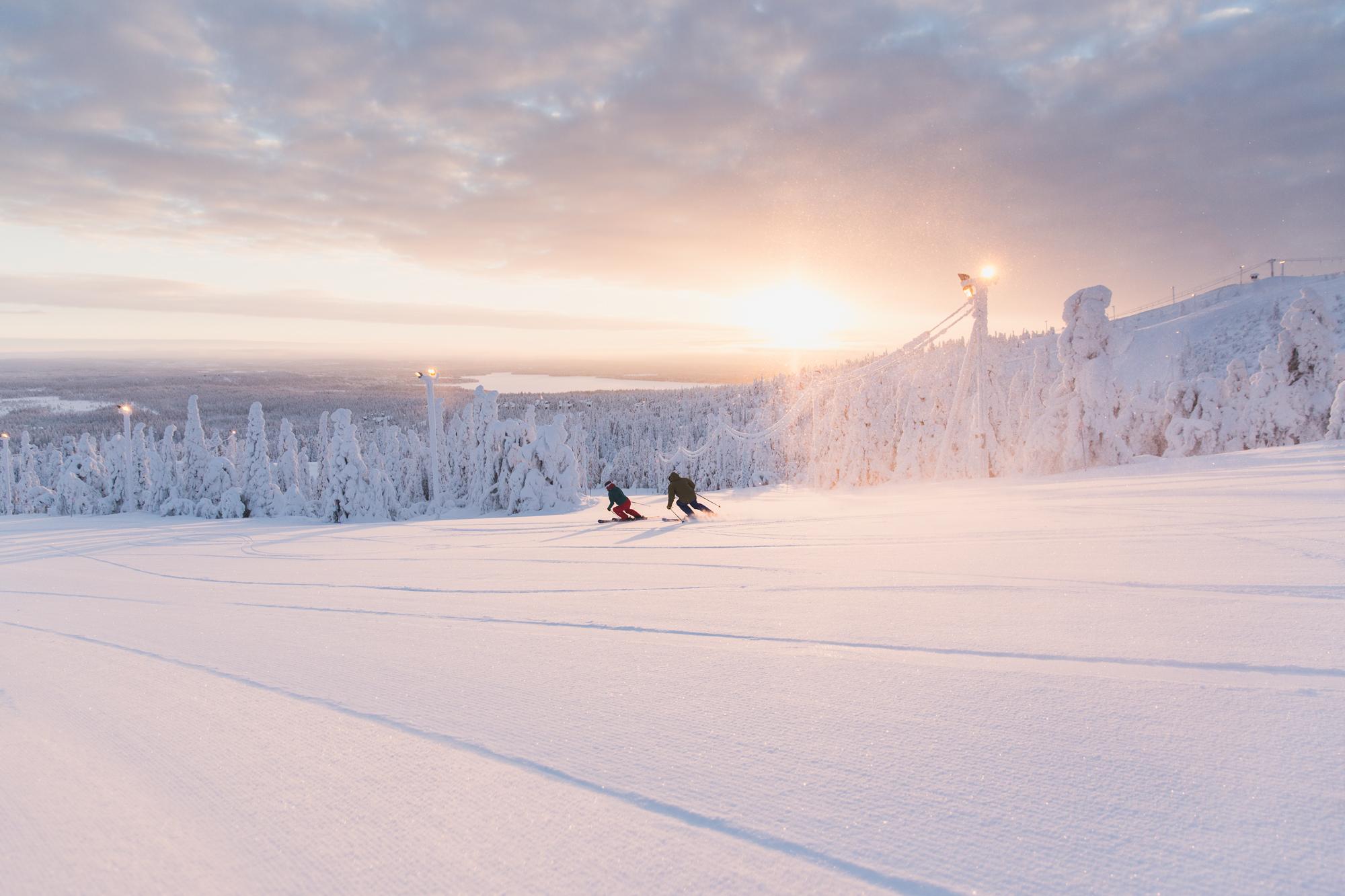 Ruka Ski Resort, skiers in sunset