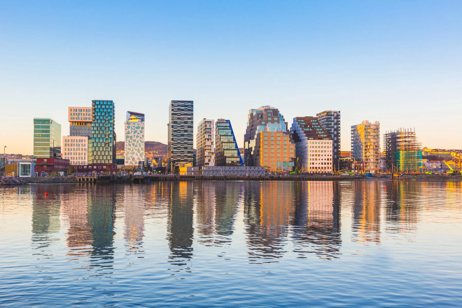 waterfront mirroring modern buildings