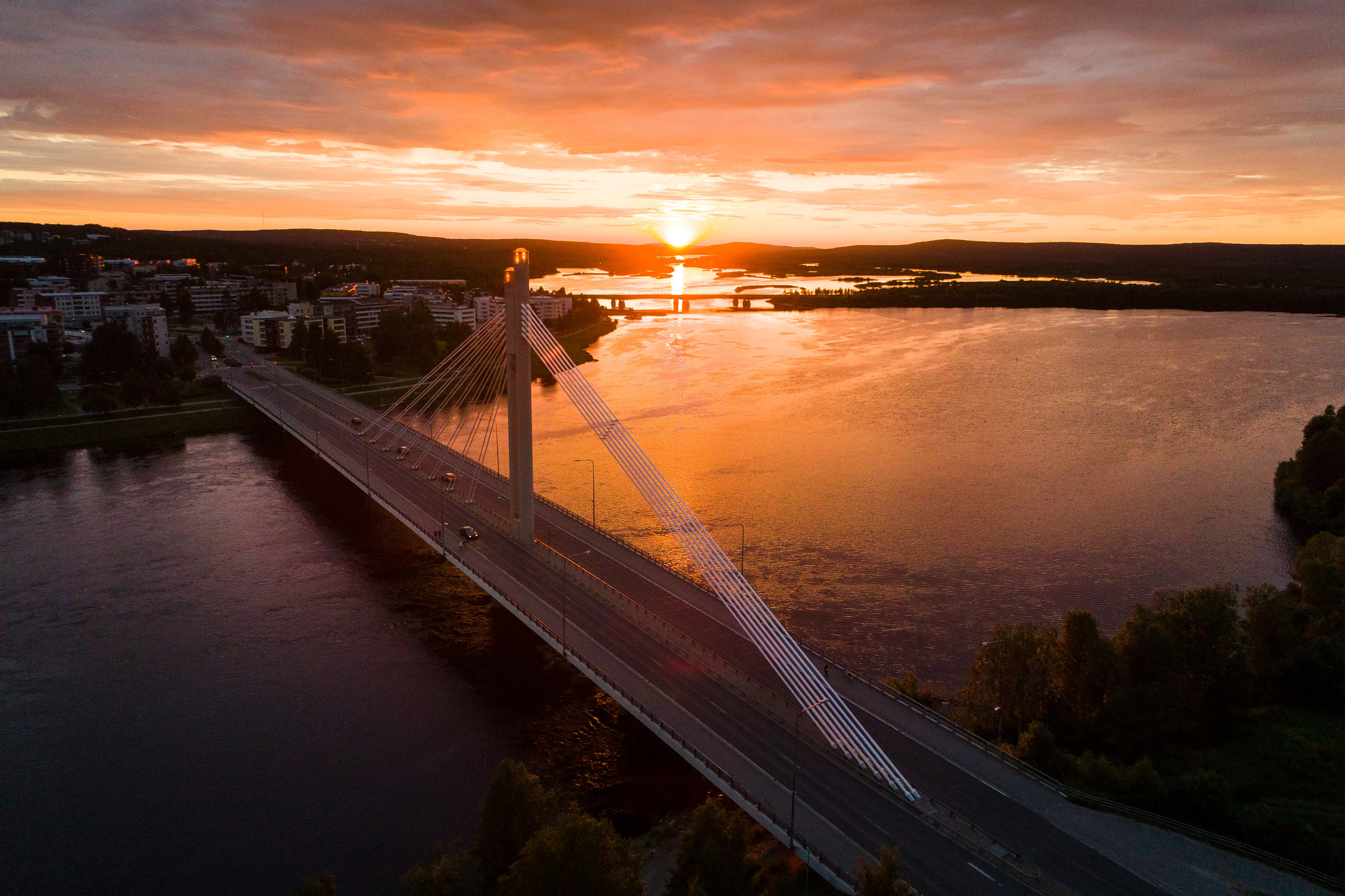 Midnight sun and Lumberjacks candle bridge in Rovaniemi Lapland Finland