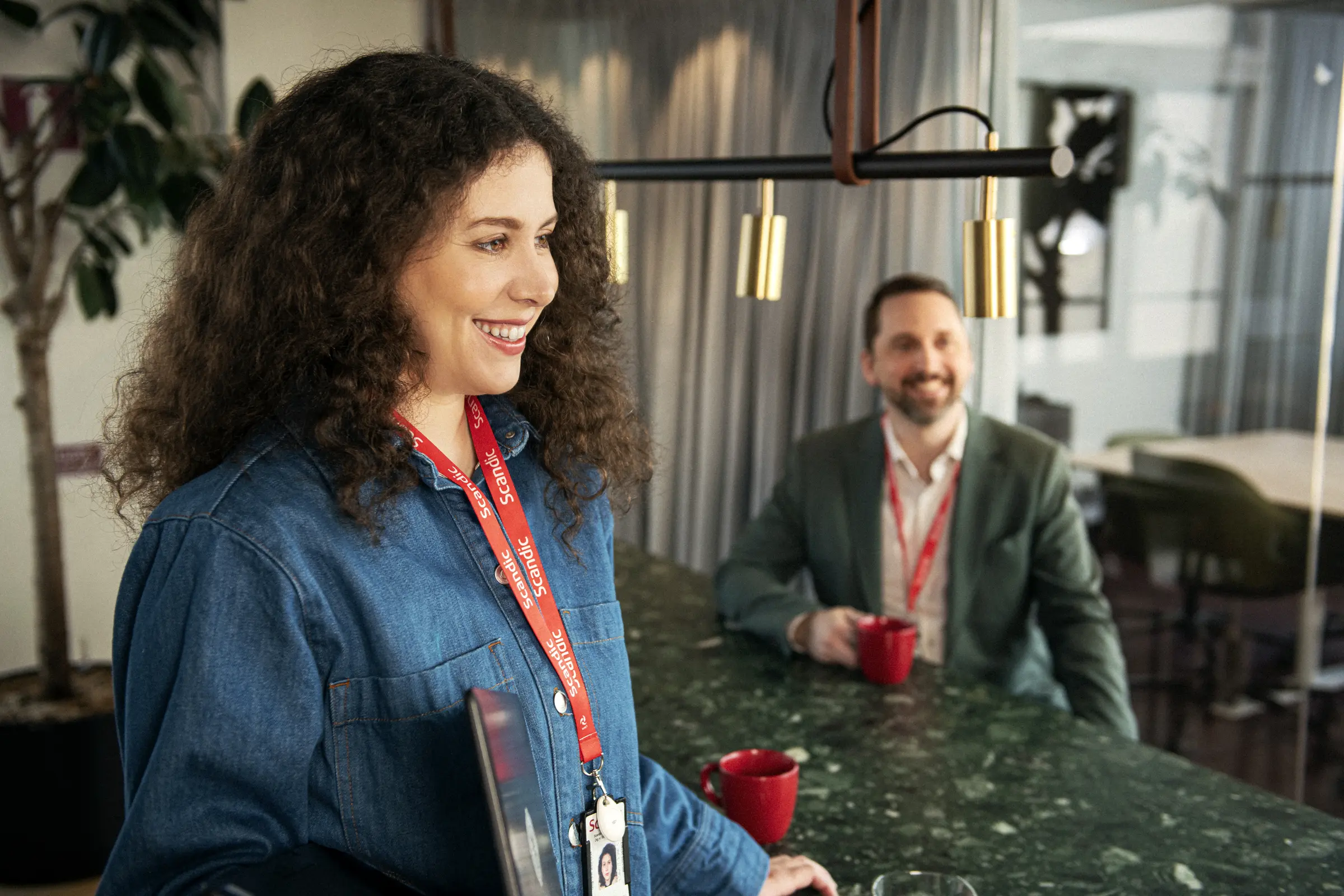 Team members with a cup of coffee