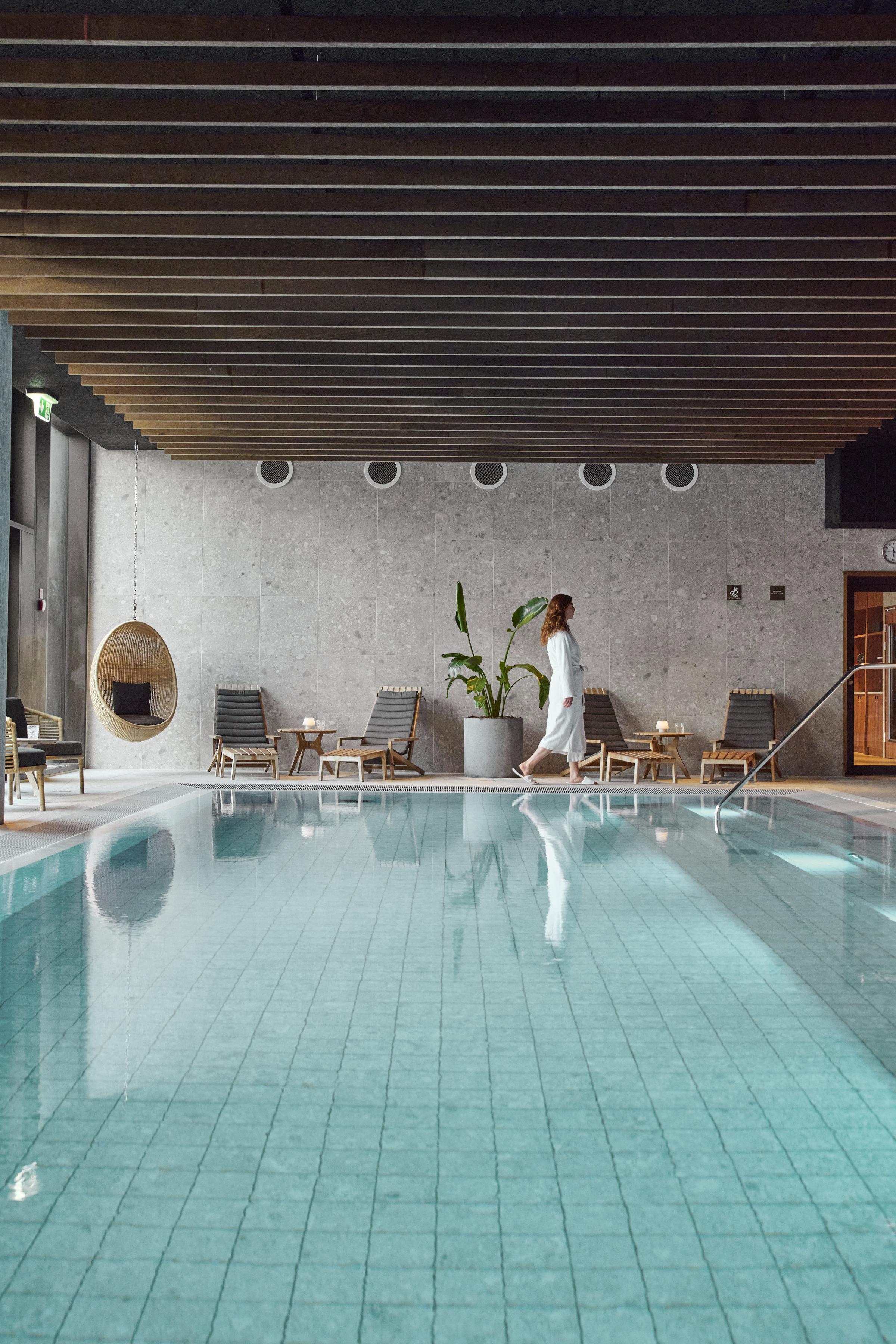 Woman beside the wellness pool